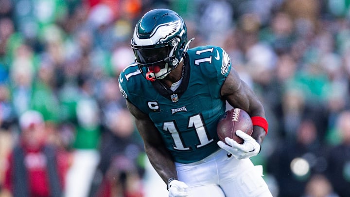 Dec 31, 2023; Philadelphia, Pennsylvania, USA; Philadelphia Eagles wide receiver A.J. Brown (11) runs with the ball during the fourth quarter against the Arizona Cardinals at Lincoln Financial Field. Mandatory Credit: Bill Streicher-Imagn Images