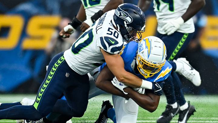 Aug 10, 2024; Inglewood, California, USA; Seattle Seahawks linebacker Patrick O'Connell (50) tackles Los Angeles Chargers running back Isaiah Spiller (28) during the fourth quarter at SoFi Stadium. Mandatory Credit: Jonathan Hui-USA TODAY Sports Aug 10, 2024; Inglewood, California, USA; Seattle Seahawks linebacker Patrick O'Connell (50) tackles Los Angeles Chargers running back Isaiah Spiller (28) during the fourth quarter at SoFi Stadium. Mandatory Credit: Jonathan Hui-USA TODAY Sports