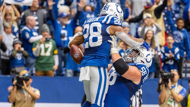 Oct 31, 2021; Indianapolis, Indiana, USA; Indianapolis Colts running back Jonathan Taylor (28) celebrates his touchdown with guard Quenton Nelson (56) in the second half against the Tennessee Titans at Lucas Oil Stadium. Mandatory Credit: Trevor Ruszkowski-USA TODAY Sports
