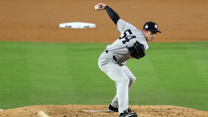 Oct 26, 2024; Los Angeles, California, USA; New York Yankees pitcher Tim Hill (54) throws a pitch against the Los Angeles Dodgers in the fifth inning for game two of the 2024 MLB World Series at Dodger Stadium. Mandatory Credit: Kiyoshi Mio-Imagn Images Oct 26, 2024; Los Angeles, California, USA; New York Yankees pitcher Tim Hill (54) throws a pitch against the Los Angeles Dodgers in the fifth inning for game two of the 2024 MLB World Series at Dodger Stadium. Mandatory Credit: Kiyoshi Mio-Imagn Images