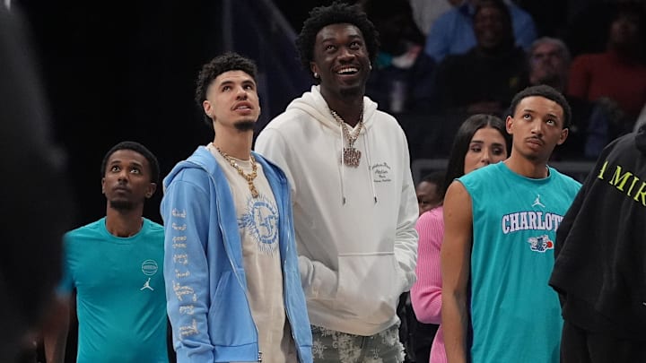 Mar 15, 2024; Charlotte, North Carolina, USA; Charlotte Hornets guard LaMelo Ball (1) and center