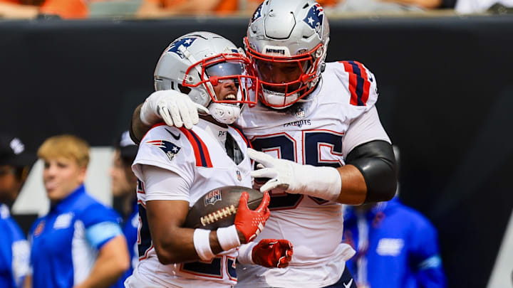 New England Patriots cornerback Marcus Jones (25) reacts with defensive tackle Daniel Ekuale (95) after recovering a fumble against the Cincinnati Bengals in the first half at Paycor Stadium.