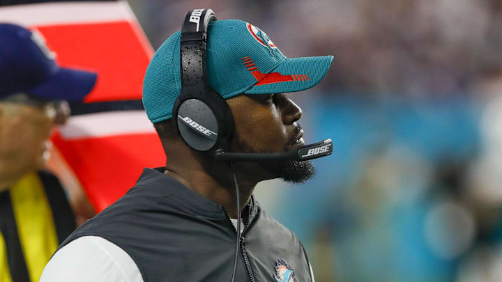 Jan 9, 2022; Miami Gardens, Florida, USA; Miami Dolphins head coach Brian Flores watches from the sideline during the second quarter against the New England Patriots at Hard Rock Stadium. Mandatory Credit: Sam Navarro-Imagn Images