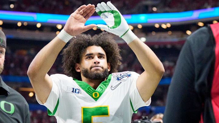 Oregon quarterback Dante Moore walks off the field as the Oregon Ducks face the Indiana Hoosiers in the Peach Bowl on Jan. 9, 2026, at Mercedes-Benz Stadium in Atlanta, Georgia.
