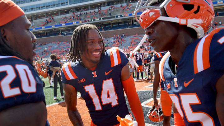 Sep 14, 2024; Champaign, Illinois, USA; Illinois Fighting Illini defensive back Xavier Scott (14) and teammates celebrate after a 30-9 victory over the Central Michigan Chippewas at Memorial Stadium. Mandatory Credit: Ron Johnson-Imagn Images Sep 14, 2024; Champaign, Illinois, USA; Illinois Fighting Illini defensive back Xavier Scott (14) and teammates celebrate after a 30-9 victory over the Central Michigan Chippewas at Memorial Stadium. Mandatory Credit: Ron Johnson-Imagn Images