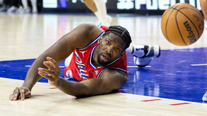 Apr 12, 2024; Philadelphia, Pennsylvania, USA; Philadelphia 76ers center Joel Embiid (21) watches a