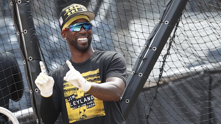 Jul 20, 2024; Pittsburgh, Pennsylvania, USA;  Pittsburgh Pirates designated hitter Andrew McCutchen (22) gestures at the batting cage before a game against the Philadelphia Phillies at PNC Park. Mandatory Credit: Charles LeClaire-Imagn Images