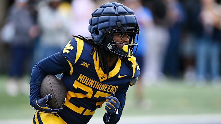 WVU cornerback Jason Chambers runs with the ball during the 2025 Gold-Blue Spring Showcase.