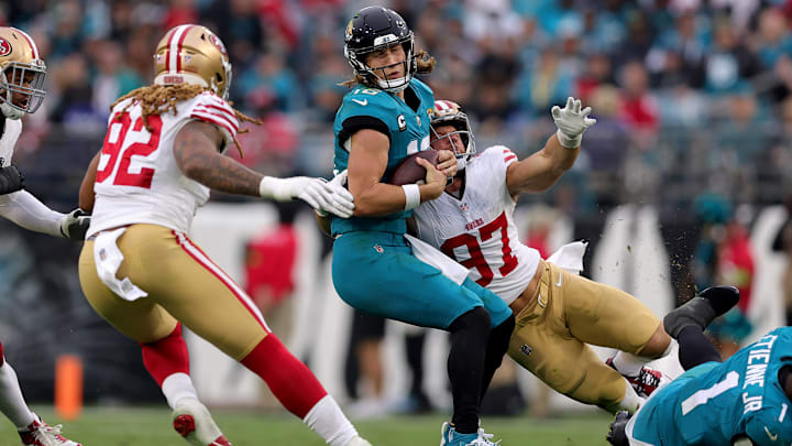 San Francisco 49ers defensive ends Nick Bosa (97) and Chase Young (92) sack Jacksonville Jaguars quarterback Trevor Lawrence (16)