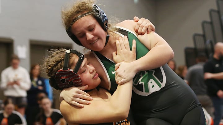 A coach on the Pella girls wrestling team helped calm a scary situation Wednesday at the local middle school.