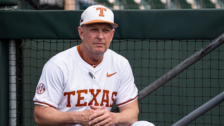 Texas Baseball coach Jim Schlossnagle watches from the dugout as the Longhorns prepare to take on the Auburn Tigers.