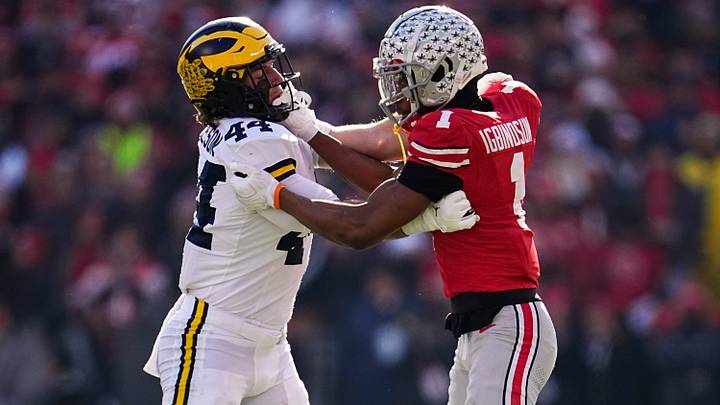 Ohio State Buckeyes cornerback Davison Igbinosun locks up with Michigan Wolverines tight end Max Bredeson Ohio State Buckeyes cornerback Davison Igbinosun locks up with Michigan Wolverines tight end Max Bredeson