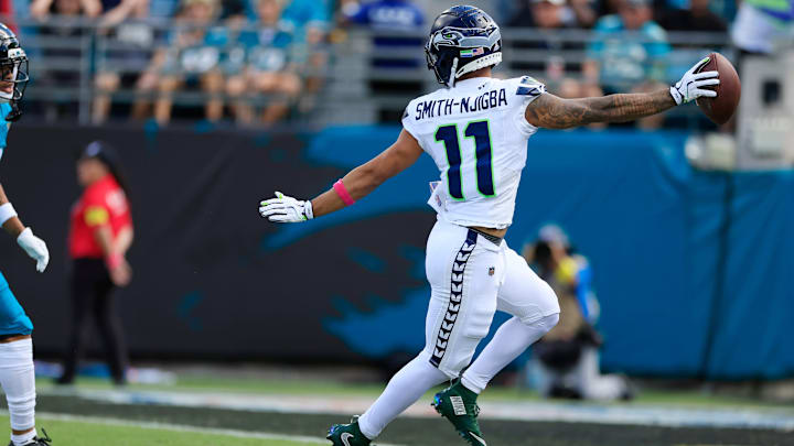 Seattle Seahawks wide receiver Jaxon Smith-Njigba (11) looks back at Jacksonville Jaguars cornerback Greg Newsome II (6) while scoring a touchdown during the second quarter of an NFL football matchup, Sunday, Oct. 12, 2025, at EverBank Stadium in Jacksonville, Fla. The Seahawks defeated the Jaguars 20-12. Seattle Seahawks wide receiver Jaxon Smith-Njigba (11) looks back at Jacksonville Jaguars cornerback Greg Newsome II (6) while scoring a touchdown during the second quarter of an NFL football matchup, Sunday, Oct. 12, 2025, at EverBank Stadium in Jacksonville, Fla. The Seahawks defeated the Jaguars 20-12.