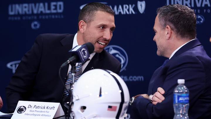 Dec 8, 2025; University Park, PA, USA; Matt Campbell, left, speaks with Penn State University athletic director Pat Kraft, right, while being announced as the Penn State Nittany Lions new head coach during a press conference at the Beaver Stadium Press Room. Mandatory Credit: Matthew O'Haren-Imagn Images Dec 8, 2025; University Park, PA, USA; Matt Campbell, left, speaks with Penn State University athletic director Pat Kraft, right, while being announced as the Penn State Nittany Lions new head coach during a press conference at the Beaver Stadium Press Room. Mandatory Credit: Matthew O'Haren-Imagn Images