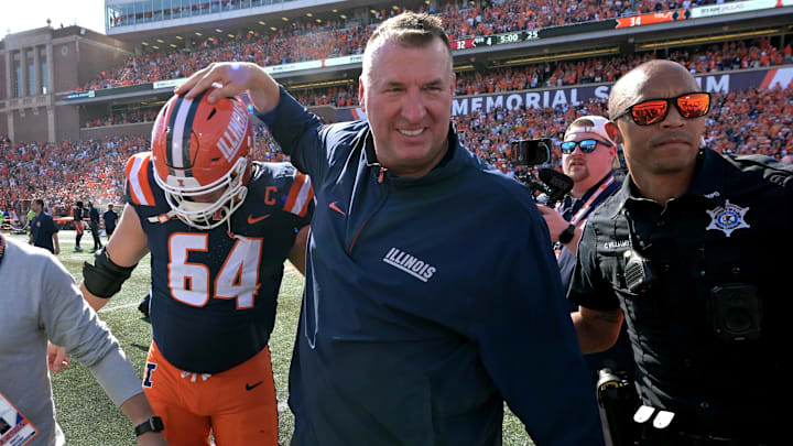 Sep 27, 2025; Champaign, Illinois, USA;  Illinois Fighting Illini head coach Bret Bielema gives players a hand after a 34-32 win against the Southern California Trojans at Memorial Stadium. Mandatory Credit: Ron Johnson-Imagn Images