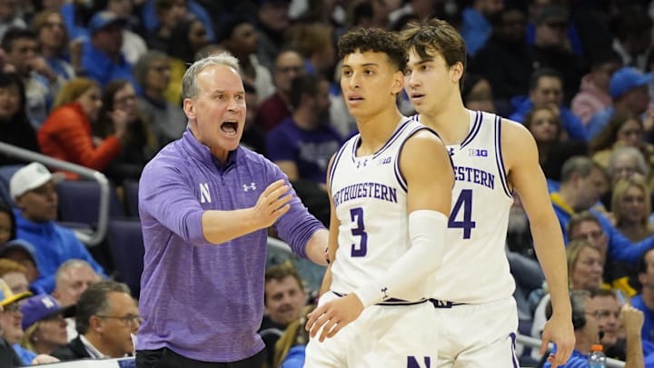 Mar 3, 2025; Evanston, Illinois, USA; Northwestern Wildcats head coach Chris Collins talks with guard Ty Berry (3) during the first half against the UCLA Bruins at Welsh-Ryan Arena. Mandatory Credit: David Banks-Imagn Images