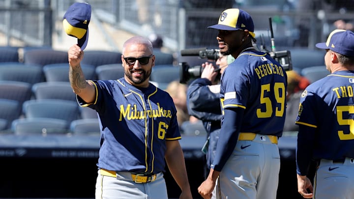 Mar 27, 2025; Bronx, New York, USA; Milwaukee Brewers pitcher Nestor Cortes (65) tips his cap towards the Yankees dugout during introductions before an opening day game against the New York Yankees at Yankee Stadium. Mandatory Credit: Brad Penner-Imagn Images