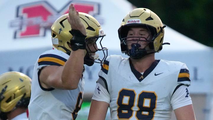 Aquinas defensive lineman Wyatt Smith (#88) celebrates a tackle with a teammate. The Cardinal Mooney Catholic High School Cougars hosted the St. Thomas Aquinas High School Raiders in their first football game of the season Friday, Aug. 14, 2026 in Sarasota.