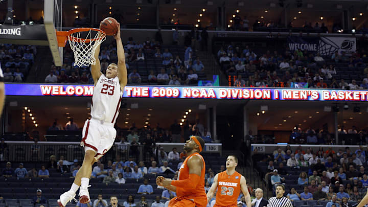 Oklahoma Sooners forward Blake Griffin (23) shoots as Syracuse Orange forward Arinze Onuaku (21) and Eric Devendorf (23) defend in the Sooners 84-71 victory against the Orange in the semifinals of the south region of the 2009 NCAA basketball tournament. Mandatory Credit: Bob Donnan-USA TODAY Sports
