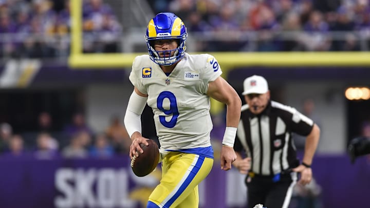 Dec 26, 2021; Minneapolis, Minnesota, USA; Los Angeles Rams quarterback Matthew Stafford (9) runs the ball during the first quarter against the Minnesota Vikings at U.S. Bank Stadium.