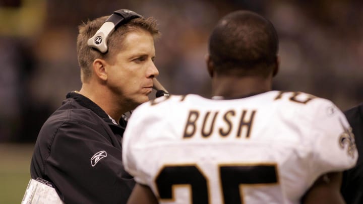 Oct. 8, 2006; New Orleans, LA, USA;  New Orleans Saints head coach Sean Payton talks with running back (25) Reggie Bush during the third quarter of the Tampa Bay Buccaneers at New Orleans Saints game at the Louisiana Superdome in New Orleans, LA. Mandatory Credit: Matt Stamey-USA TODAY Sports Copyright Matt Stamey

