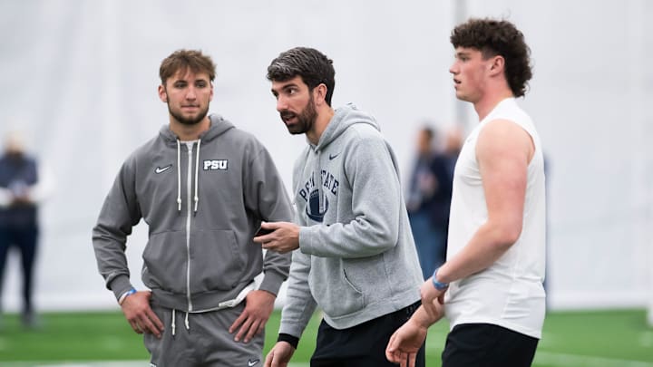 Penn State quarterbacks coach Danny O'Brien talks with Nittany Lions quarterback Drew Allar, right, and Ethan Grunkemeyer. 
