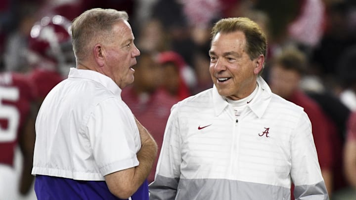Nov 4, 2023; Tuscaloosa, Alabama, USA;  LSU Tigers head coach Brian Kelly and Alabama Crimson Tide head coach Nick Saban talk together at midfield before the Alabama vs LSU game at Bryant-Denny Stadium. Mandatory Credit: Gary Cosby Jr.-Imagn Images