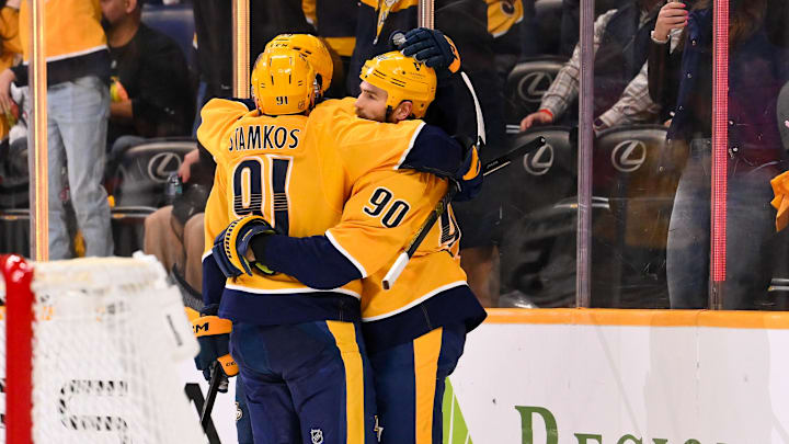 Feb 26, 2026; Nashville, Tennessee, USA; Nashville Predators center Ryan O'Reilly (90) celebrates his goal with center Steven Stamkos (91) and defenseman Roman Josi (59) against the Chicago Blackhawks during the third period at Bridgestone Arena. Mandatory Credit: Steve Roberts-Imagn Images Feb 26, 2026; Nashville, Tennessee, USA; Nashville Predators center Ryan O'Reilly (90) celebrates his goal with center Steven Stamkos (91) and defenseman Roman Josi (59) against the Chicago Blackhawks during the third period at Bridgestone Arena. Mandatory Credit: Steve Roberts-Imagn Images