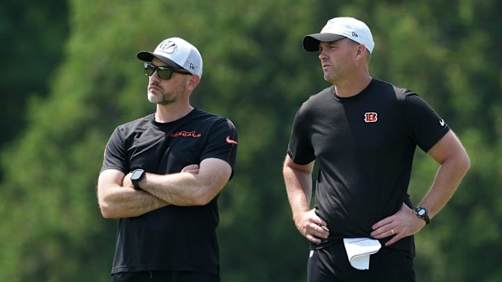 Jun 10, 2025; Cincinnati, OH, USA; Cincinnati Bengals offensive coordinator Dan Pitcher and head coach Zac Taylor talk during practice at Paycor Stadium. Mandatory Credit: Kareem Elgazzar-Imagn Images