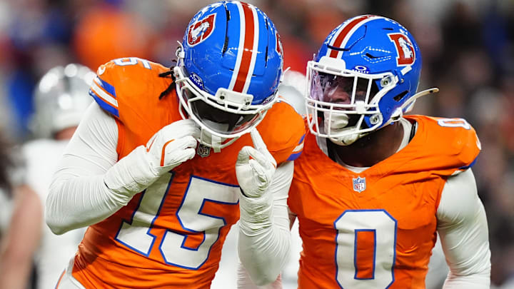 Nov 6, 2025; Denver, Colorado, USA; Denver Broncos linebacker Nik Bonitto (15) and linebacker Jonathon Cooper (0) react during the first half at Empower Field at Mile High. Nov 6, 2025; Denver, Colorado, USA; Denver Broncos linebacker Nik Bonitto (15) and linebacker Jonathon Cooper (0) react during the first half at Empower Field at Mile High.