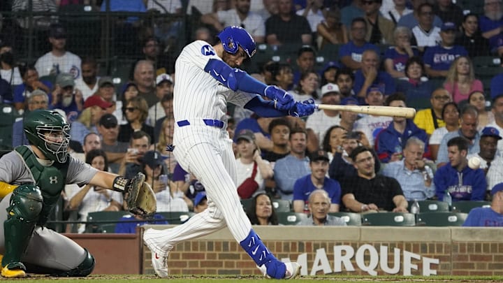 Sep 16, 2024; Chicago, Illinois, USA; Chicago Cubs outfielder Cody Bellinger (24) hits a single against the Oakland Athletics during the first inning at Wrigley Field. Sep 16, 2024; Chicago, Illinois, USA; Chicago Cubs outfielder Cody Bellinger (24) hits a single against the Oakland Athletics during the first inning at Wrigley Field.