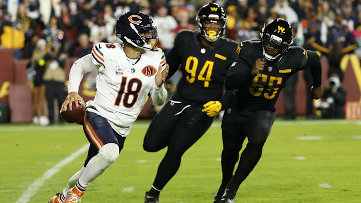 Caleb Williams looks downfield for a receiver with the Commanders' pass rush giving chase in Monday night's Bears victory.