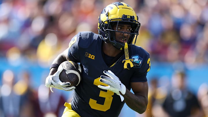 Dec 31, 2024; Tampa, FL, USA; Michigan Wolverines wide receiver Fredrick Moore (3) runs with the ball against the Alabama Crimson Tide  in the third quarter  during the ReliaQuest Bowl at Raymond James Stadium. Mandatory Credit: Nathan Ray Seebeck-Imagn Images