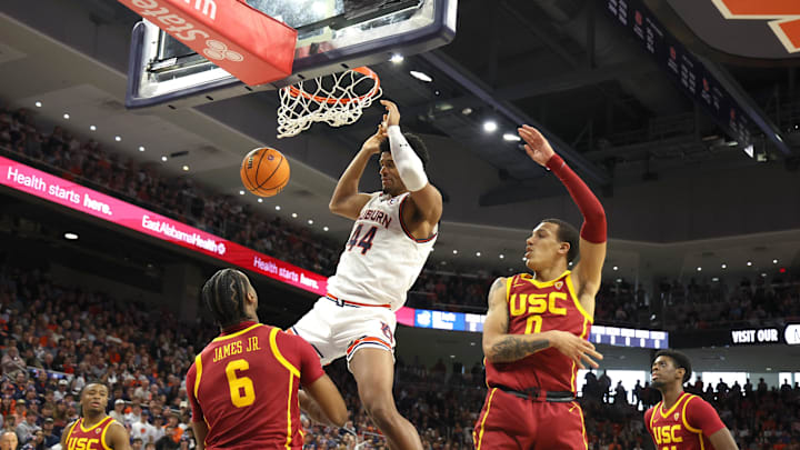 Dec 17, 2023; Auburn, Alabama, USA;  Auburn Tigers center Dylan Cardwell (44) completes a dunk
