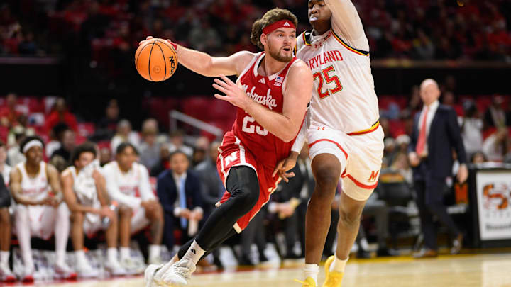 Jan 19, 2025; College Park, Maryland, USA; Nebraska Cornhuskers forward Andrew Morgan (23) drives to the basket against Maryland Terrapins center Derik Queen (25) during the first half at Xfinity Center.
