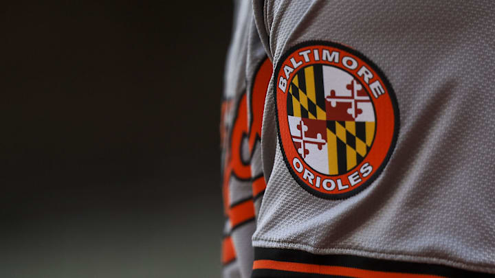 May 5, 2024; Cincinnati, Ohio, USA; The Baltimore Orioles logo on the sleeve of designated hitter Gunnar Henderson (2) as he prepares on deck during the seventh inning against the Cincinnati Reds at Great American Ball Park. Mandatory Credit: Katie Stratman-Imagn Images