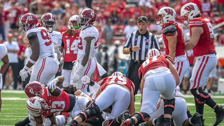 Wisconsin Darrion Dupree (13) keeps hold of the ball through a tackle during the game against Alabama at Camp Randall Stadium in Madison, Wis. on Saturday, September 14, 2024.