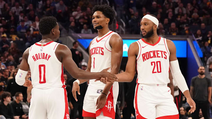 Nov 26, 2025; San Francisco, California, USA;  Houston Rockets guard Aaron Holiday (0), guard-forward Amen Thompson (1), and guard Josh Okogie (20) huddle during a break in the action against the Golden State Warriors in the fourth quarter at Chase Center. Mandatory Credit: David Gonzales-Imagn Images
