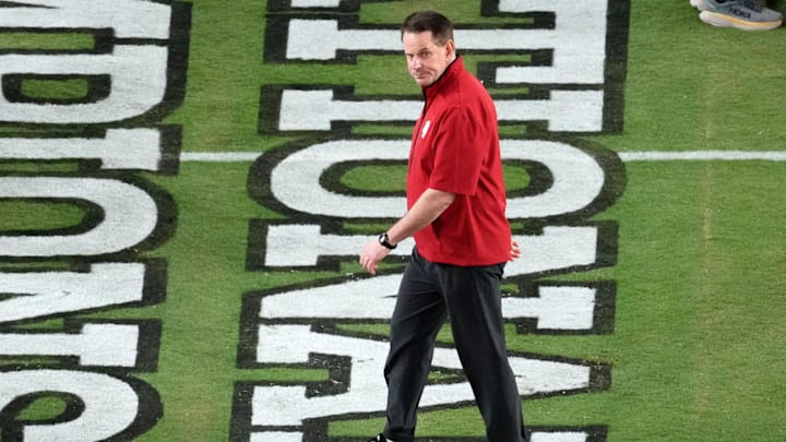 Jan 19, 2026; Miami Gardens, FL, USA; Indiana Hoosiers head coach Curt Cignetti walks on the field before the CFP National Championship college football game between the Indiana Hoosiers and the Miami Hurricanes at Hard Rock Stadium. Mandatory Credit: James Lang-Imagn Images