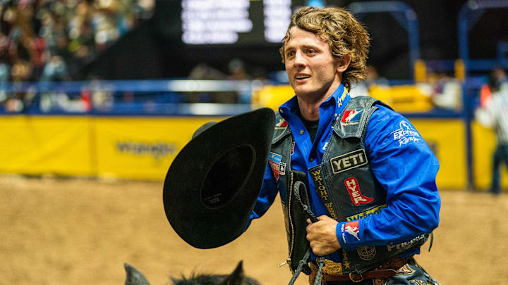 Stetson Wright tipping his hat the crowd as he takes a victory lap at the NFR Stetson Wright tipping his hat the crowd as he takes a victory lap at the NFR