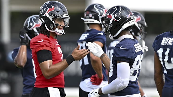 Jun 10, 2025; Houston, TX, USA; Houston Texans quarterback C.J. Stroud (7) and wide receiver Xavier Johnson (89) interact during an NFL football minicamp at NRG Stadium. Mandatory Credit: Maria Lysaker-Imagn Images 