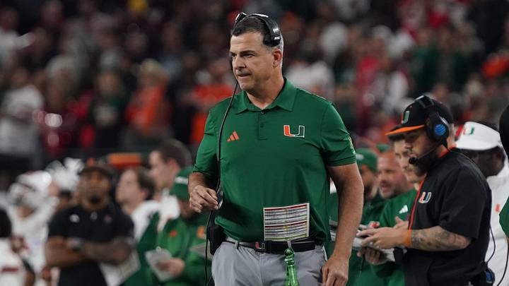 Dec 31, 2025; Arlington, TX, USA; Miami Hurricanes head coach Mario Cristobal stands on the sidelines against the Ohio State Buckeyes during the second half of 2025 Cotton Bowl and quarterfinal game of the College Football Playoff at AT&T Stadium. Mandatory Credit: Raymond Carlin III-Imagn Images