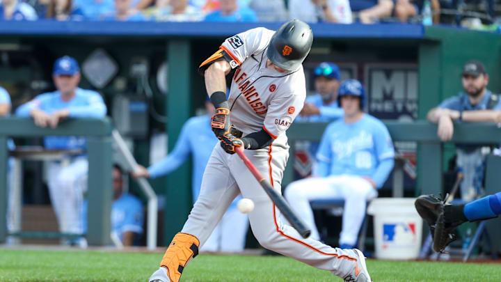 Sep 21, 2024; Kansas City, Missouri, USA; San Francisco Giants right fielder Mike Yastrzemski (5) hits a foul ball during the fourth inning against the Kansas City Royals at Kauffman Stadium.