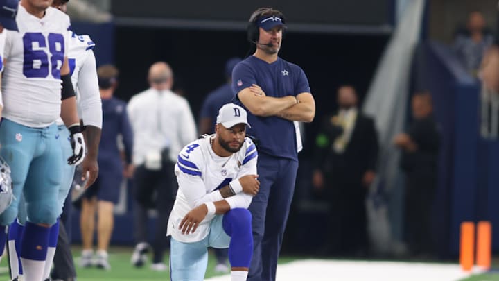 Dallas Cowboys QB Dak Prescott and Brian Schottenheimer watch a play in the game against the Jacksonville Jaguars.