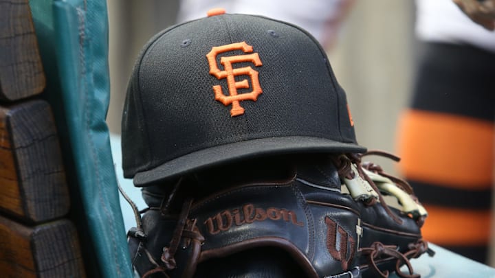 Jul 14, 2023; Pittsburgh, Pennsylvania, USA;  San Francisco Giants hat and glove on the bench against the Pittsburgh Pirates during the first inning at PNC Park. 