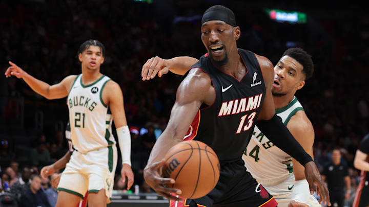 Mar 12, 2026; Miami, Florida, USA; Miami Heat center Bam Adebayo (13) protects the basketball against Milwaukee Bucks forward Giannis Antetokounmpo (34) during the third quarter at Kaseya Center. Mandatory Credit: Sam Navarro-Imagn Images