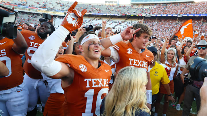 Texas Longhorns defensive back Michael Taaffe celebrates with Texas Longhorns quarterback Arch Manning after the game against the Oklahoma Sooners at the Cotton Bowl. Texas Longhorns defensive back Michael Taaffe celebrates with Texas Longhorns quarterback Arch Manning after the game against the Oklahoma Sooners at the Cotton Bowl.