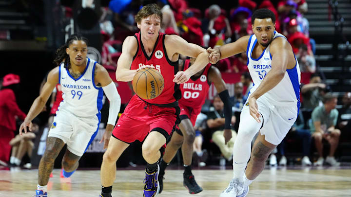 Jul 14, 2024; Las Vegas, NV, USA; Chicago Bulls forward Matas Buzelis (14) dribbles against Golden State Warriors forward Trayce Jackson-Davis (32): Stephen R. Sylvanie-USA TODAY Sports