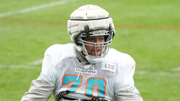 Miami Dolphins offensive tackle Kendall Lamm (70) wears a Guardian helmet cap during practice at the PSD Bank Arena in Germany in 2023.