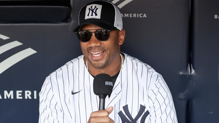 New York Giants quarterback Russell Wilson is interviewed prior to the game between the New York Mets and the New York Yankees at Yankee Stadium. 